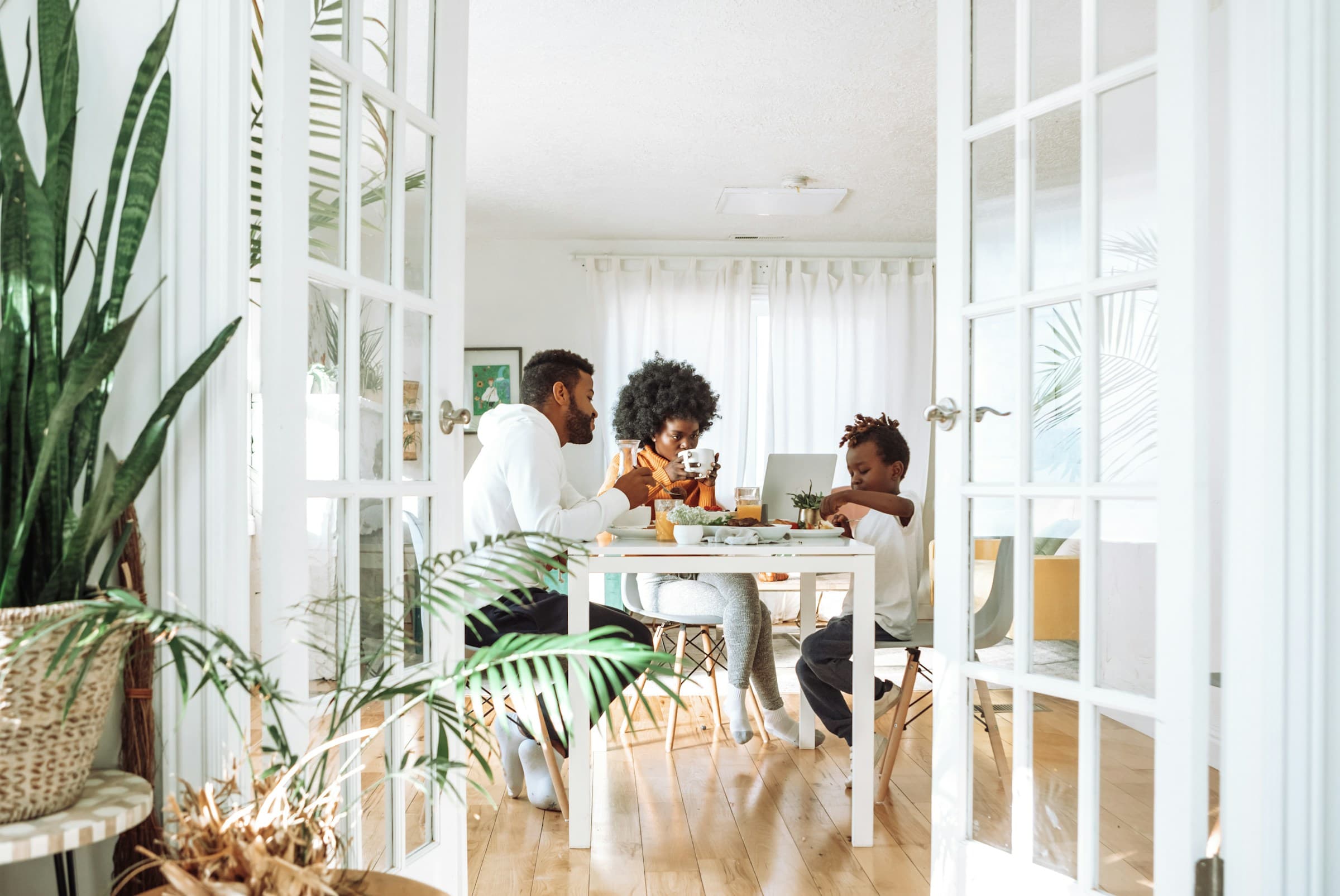 A family having breakfast together in a bright Florida home